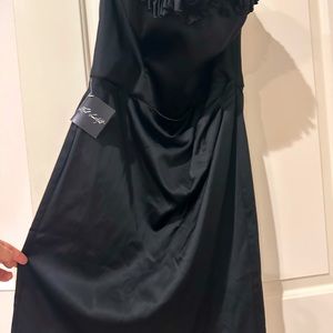 BNWT White House Black Market black strapless dress with intricate detail.